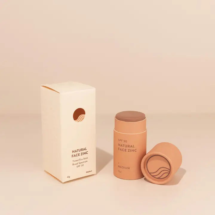 Natural face zinc product with packaging on a beige background